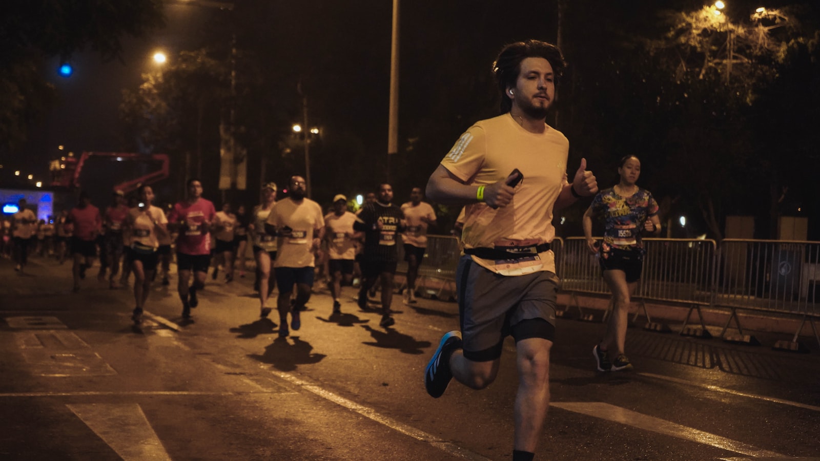 Runners in a night road race for SeeMyRace featured project